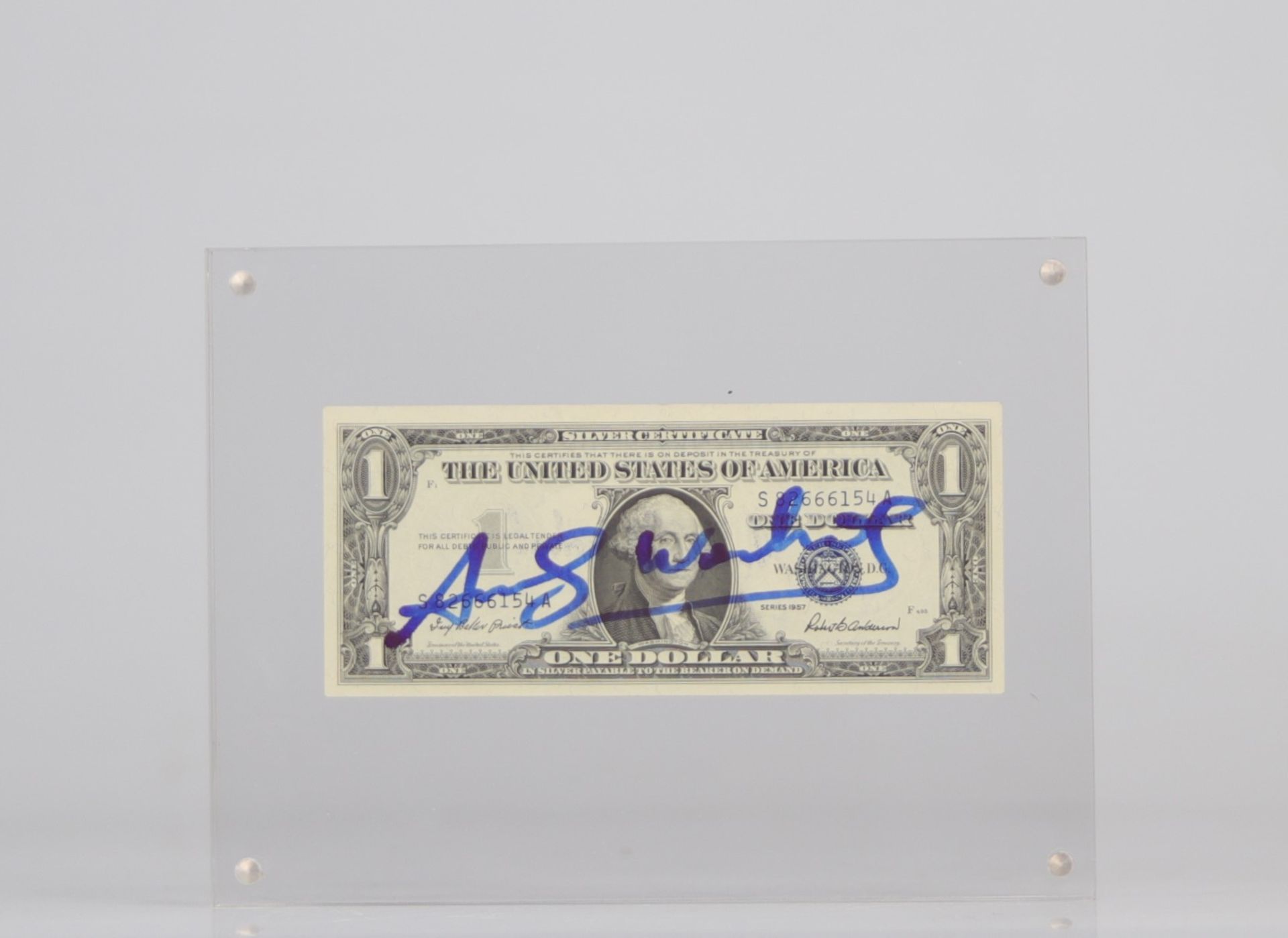 Andy Warhol. 1 dollar bill embellished with the signature of "Andy Warhol" in felt pen.