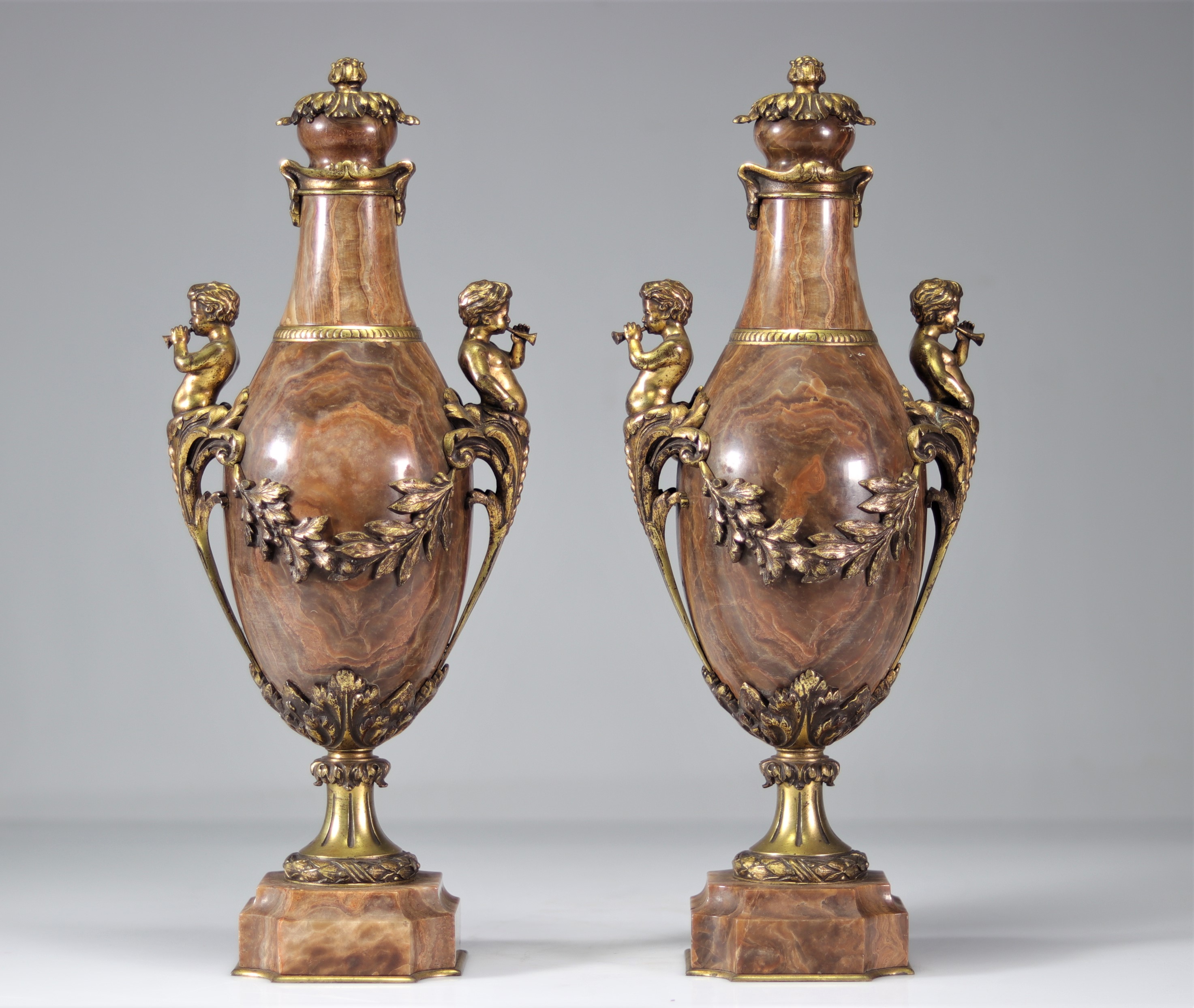 Pair of marble vases decorated with gilt bronze musical fauns