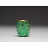Daum Nancy tumbler decorated with flowers on a green background