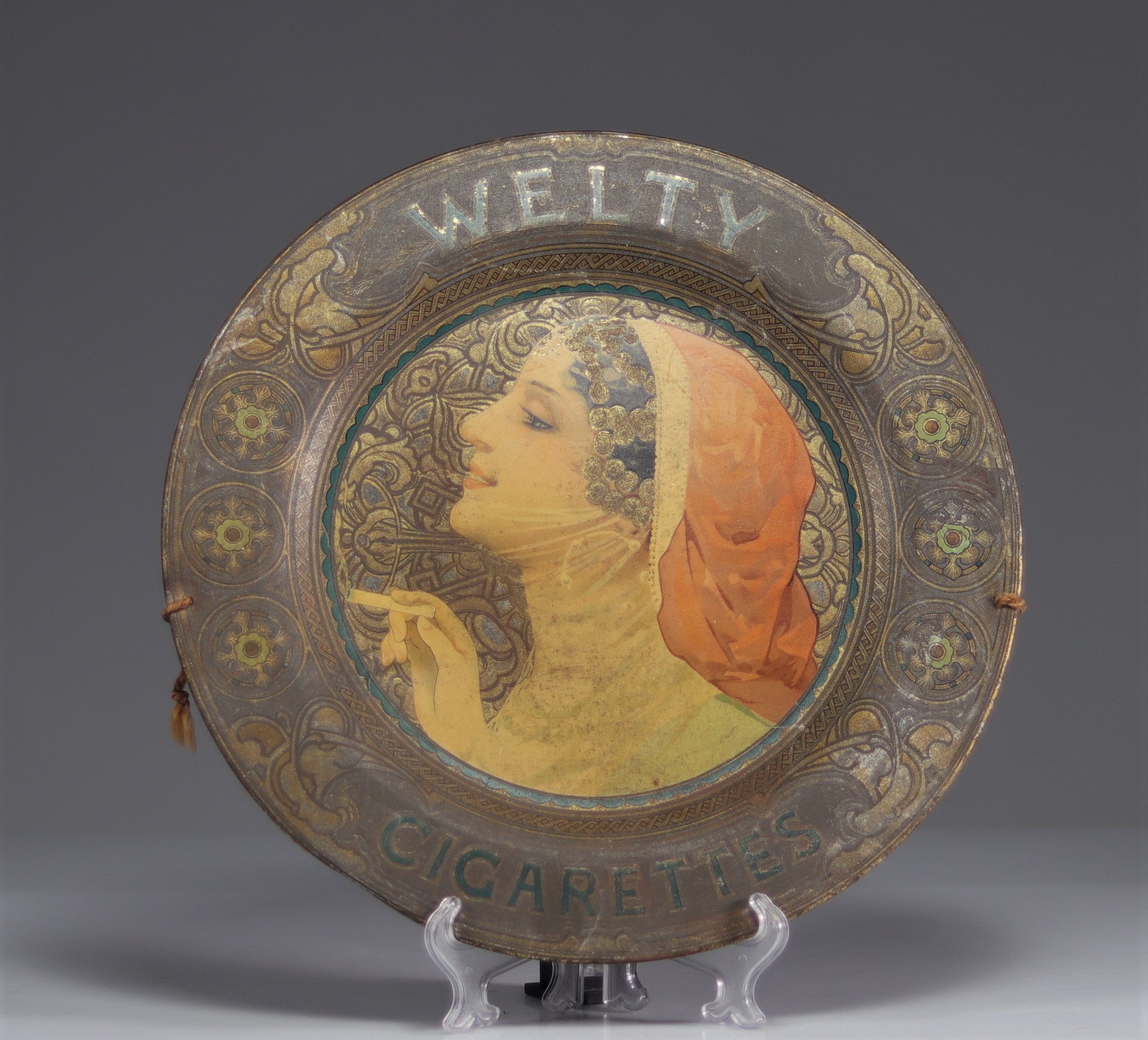 Advertising tray for Welty Cigarettes around 1900.