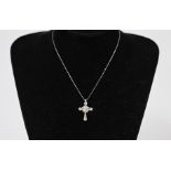 Cross in platinum and diamonds and emeralds (5.5gr)
