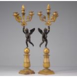 Pair of period Empire candelabras decorated with angels in bronze with two patinas