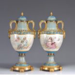 Sevres imposing pair of vases decorated with romantic scenes and cupids in gilded bronze