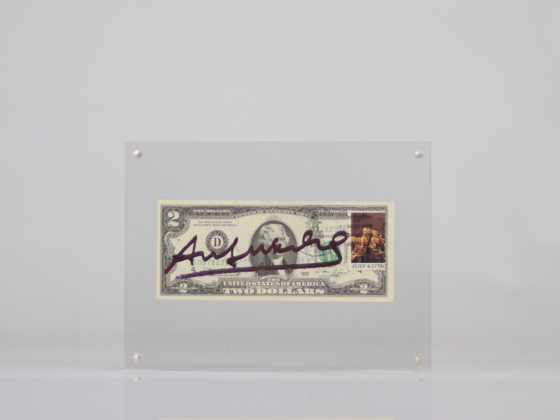 Andy Warhol. 2 dollar bill with the signature of "Andy Warhol" in felt pen.