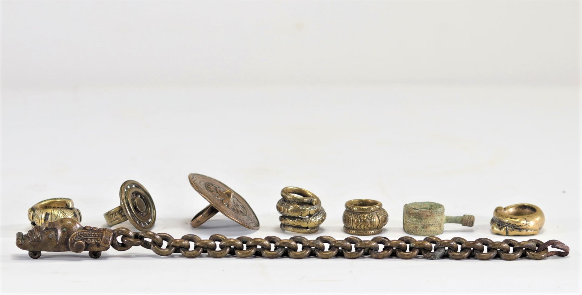Lot (7) of Batak Sumatra bronze rings and a jewel