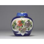 Blue powder-coated vase decorated with flowers