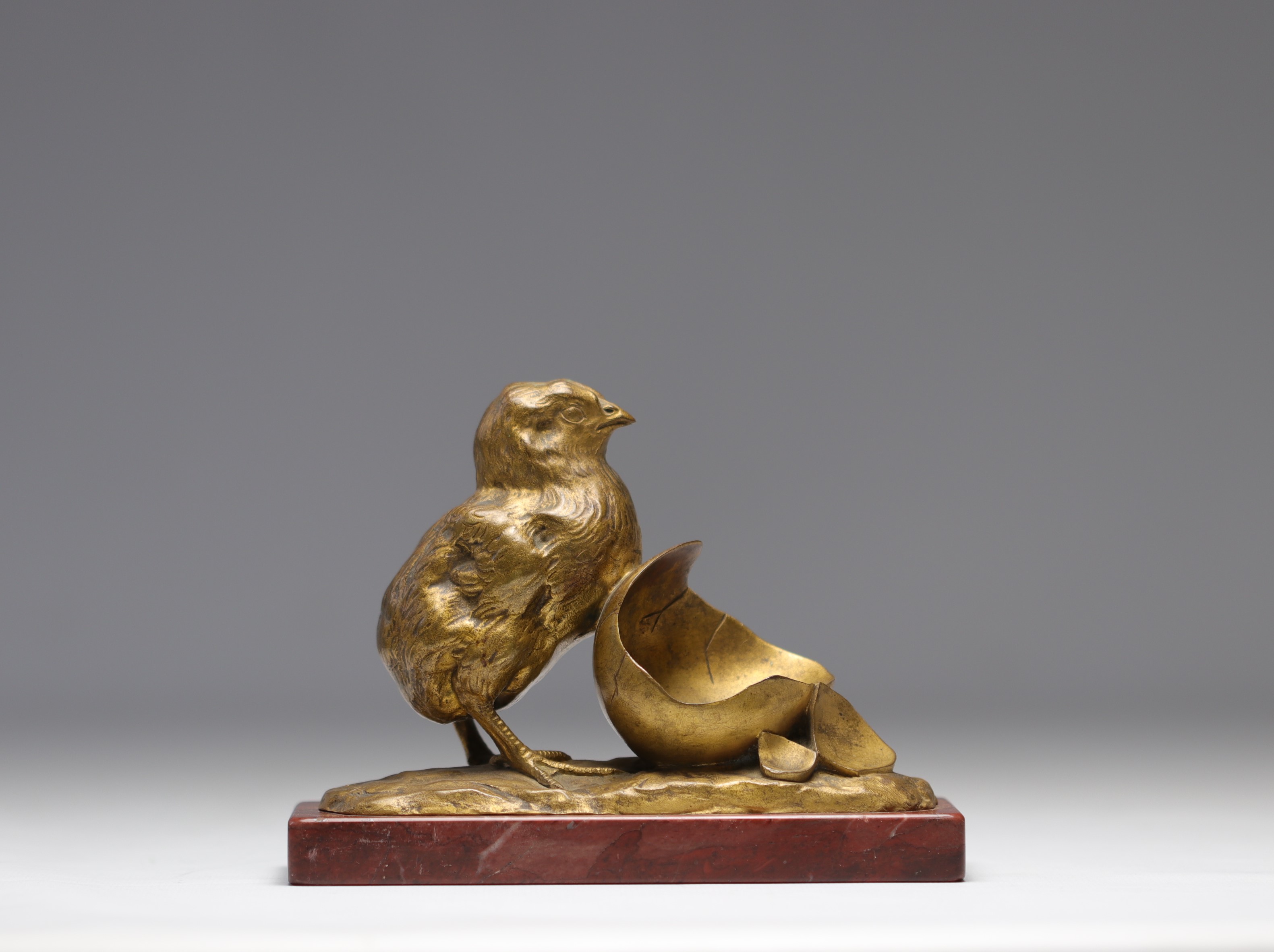 GARDET Georges (1863-1939) "The chick coming out of the egg" in bronze with a golden patina, signed