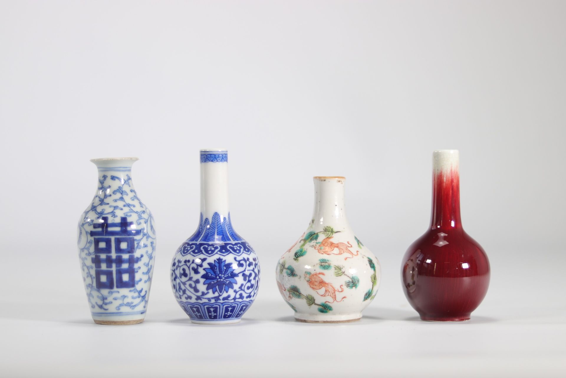 (4) Set of porcelain vases in white, blue and oxblood from Qing period (æ¸…æœ)