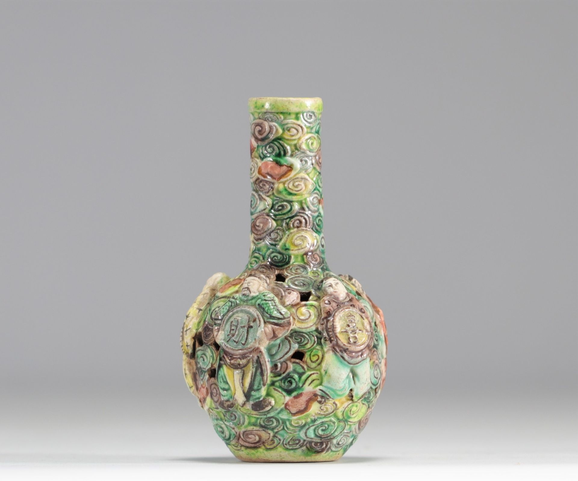 Small vase in relief from the Famille Verte decorated with figures