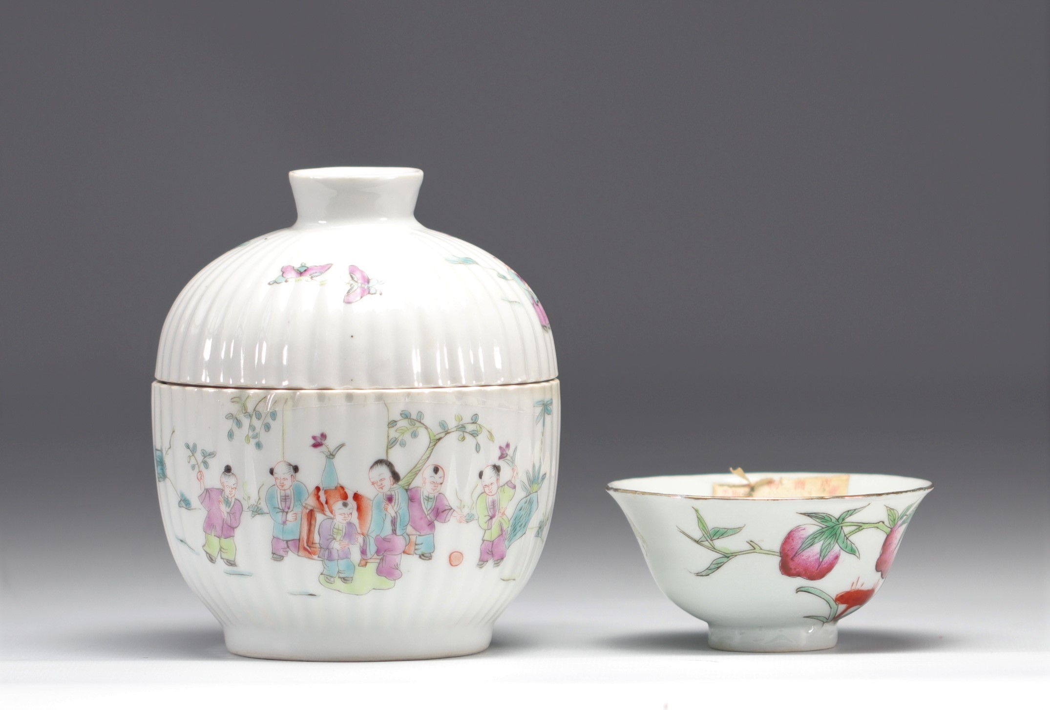 Covered pot and bowl in Famille Rose porcelain decorated with figures and peaches