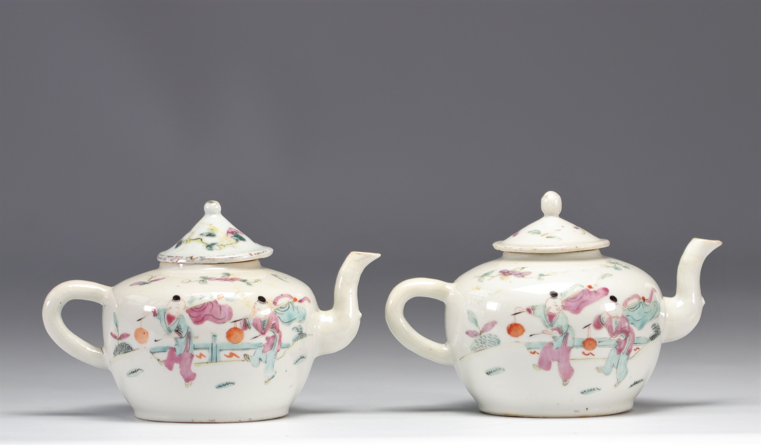 (2) Famille Rose porcelain teapots decorated with figures