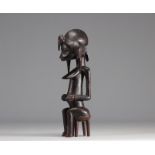 Beautiful seated Senufo female statue from Cote d'Ivoire