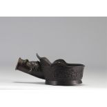 Bronze iron decorated with archaic motifs dating from the 13th century - the moulding has the head o