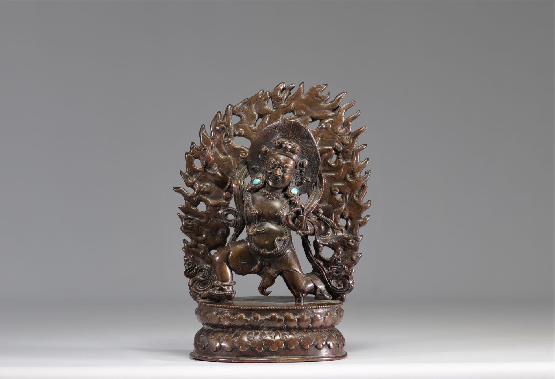 Large sculpture of a Tibetan divinity in bronze inlaid with turquoise, 18th century