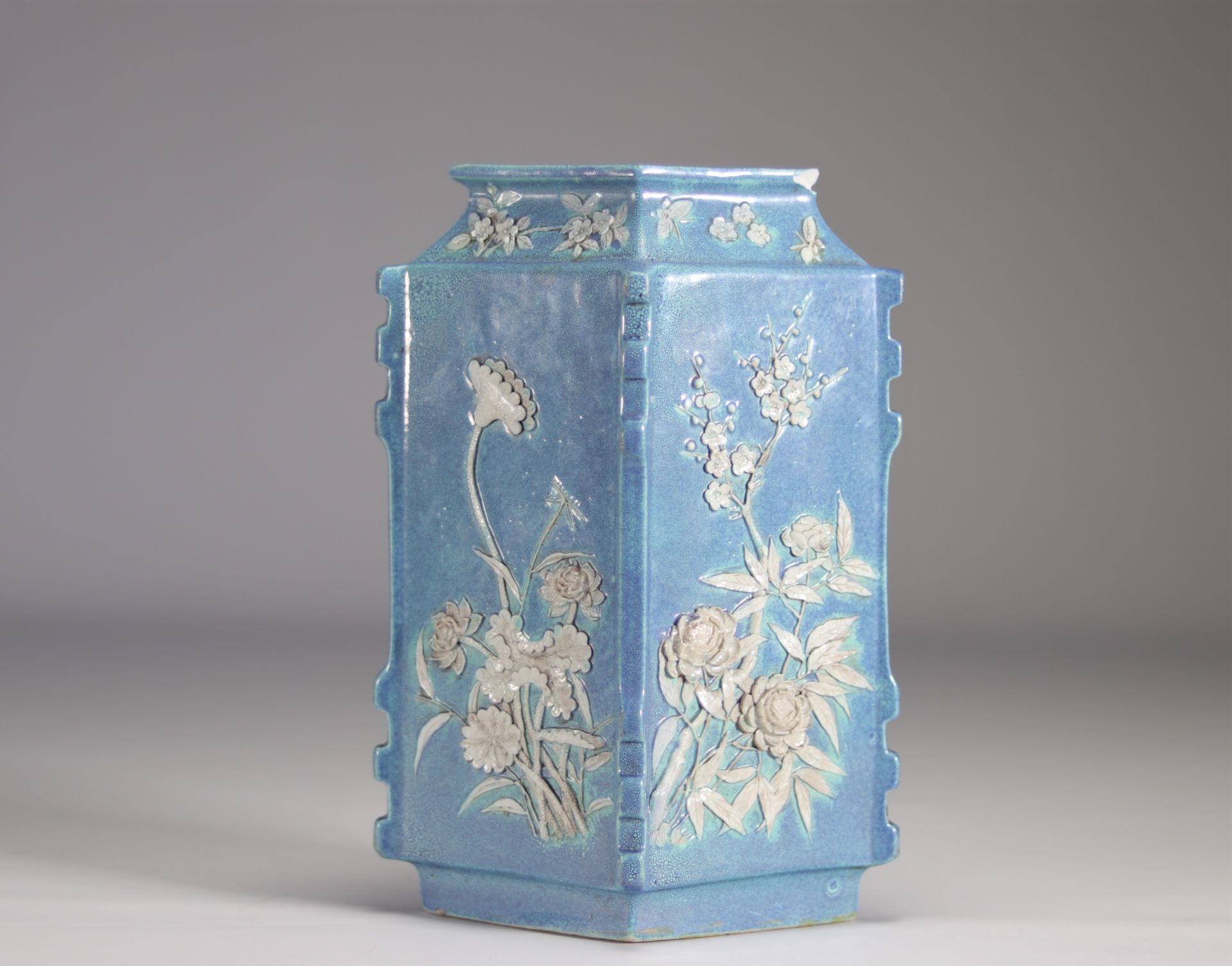 A Chinese porcelain vase decorated with flowers in relief on a light blue background from Qing perio - Image 3 of 5