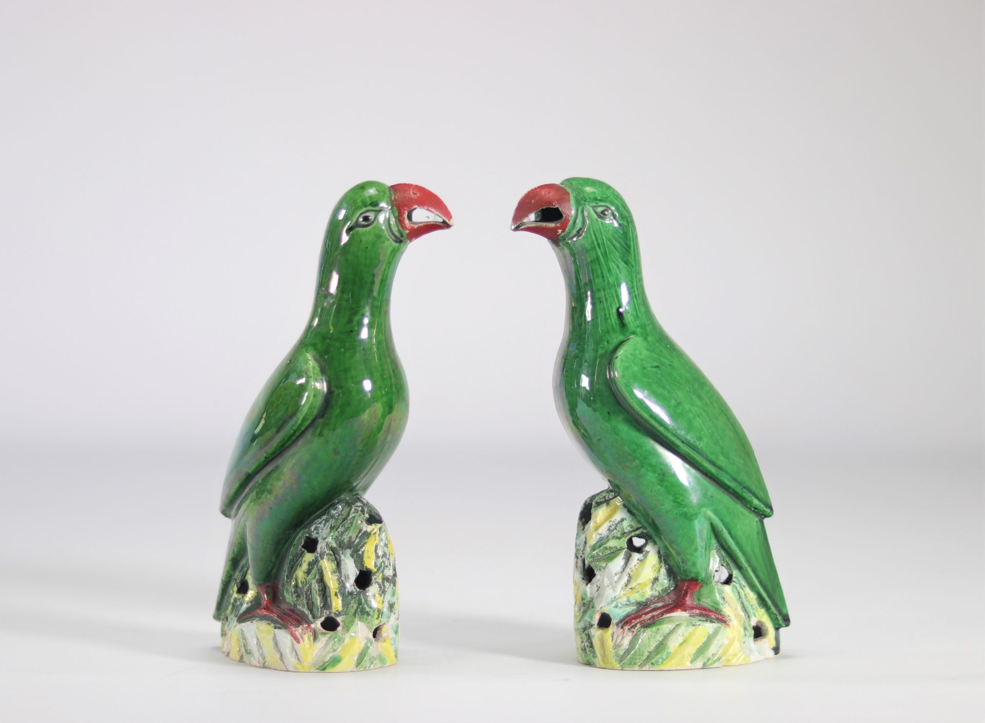 Pair of green glazed 'parrot' birds from China from the 19th century