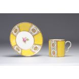 Paris porcelain cup decorated with flowers on a yellow background