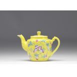 Famille Rose porcelain teapot decorated with flowers on a yellow background