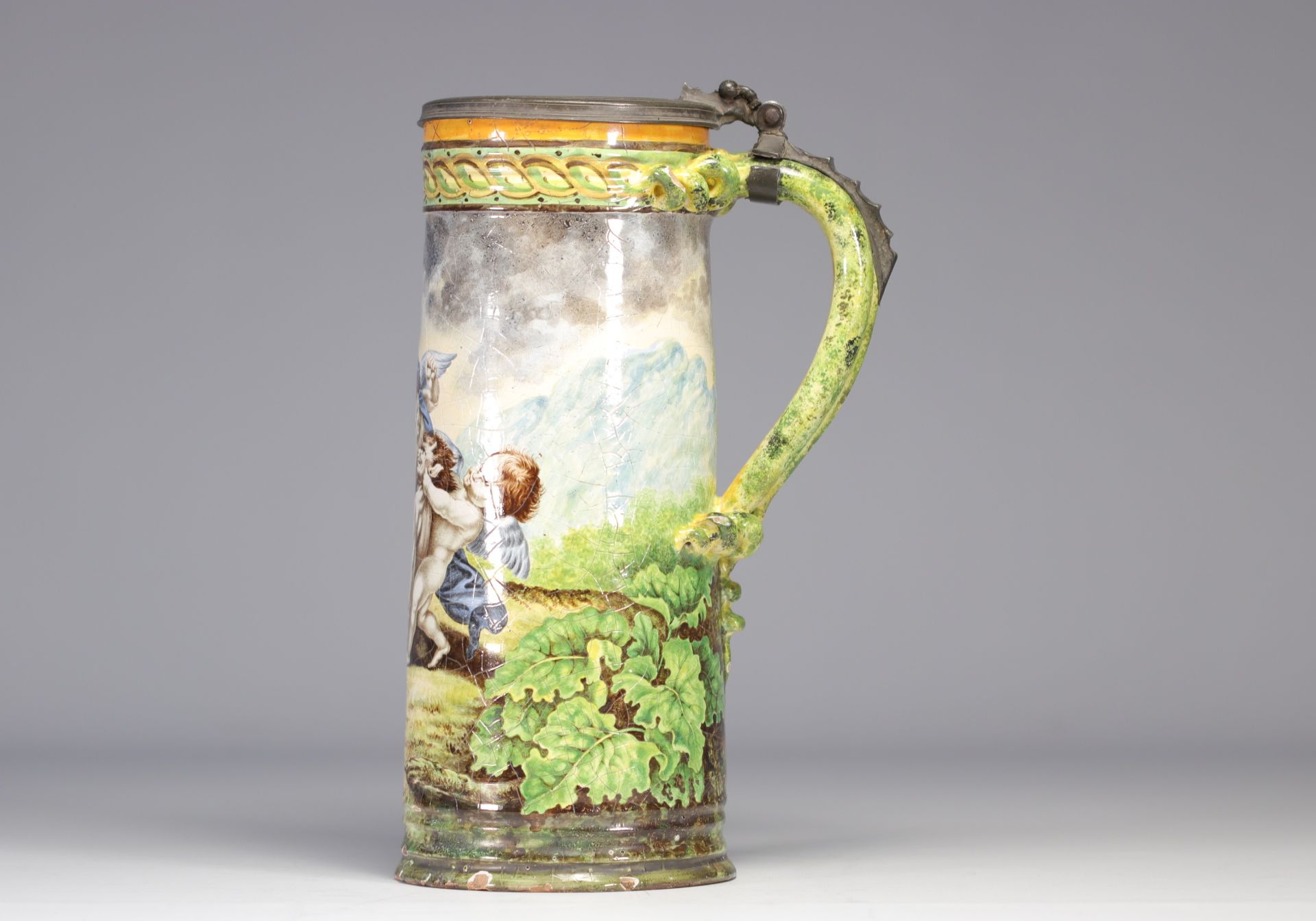 Italian majolica mug decorated with angels playing with a faun - Image 2 of 4