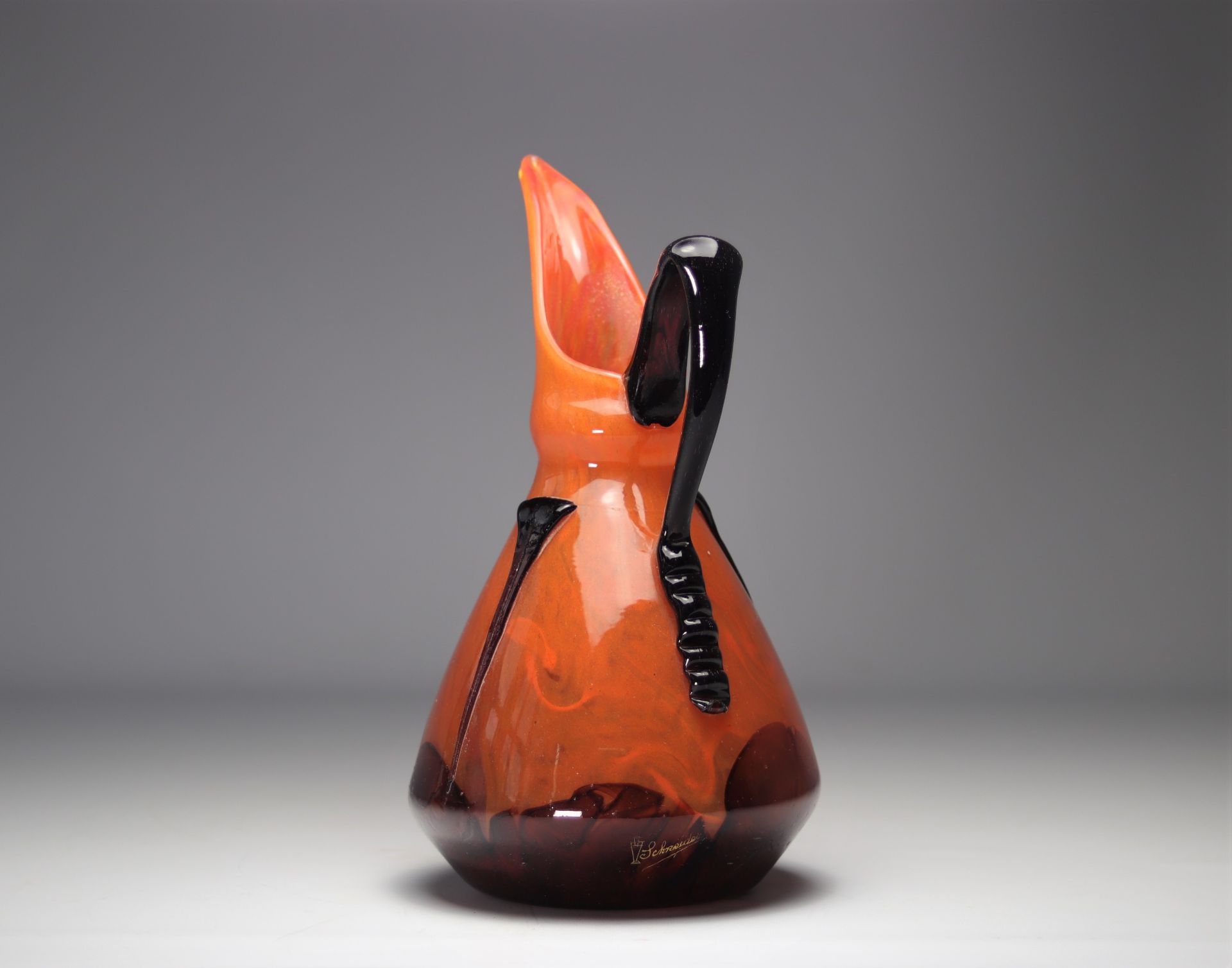 SCHNEIDER Proof glass pitcher on an orange background