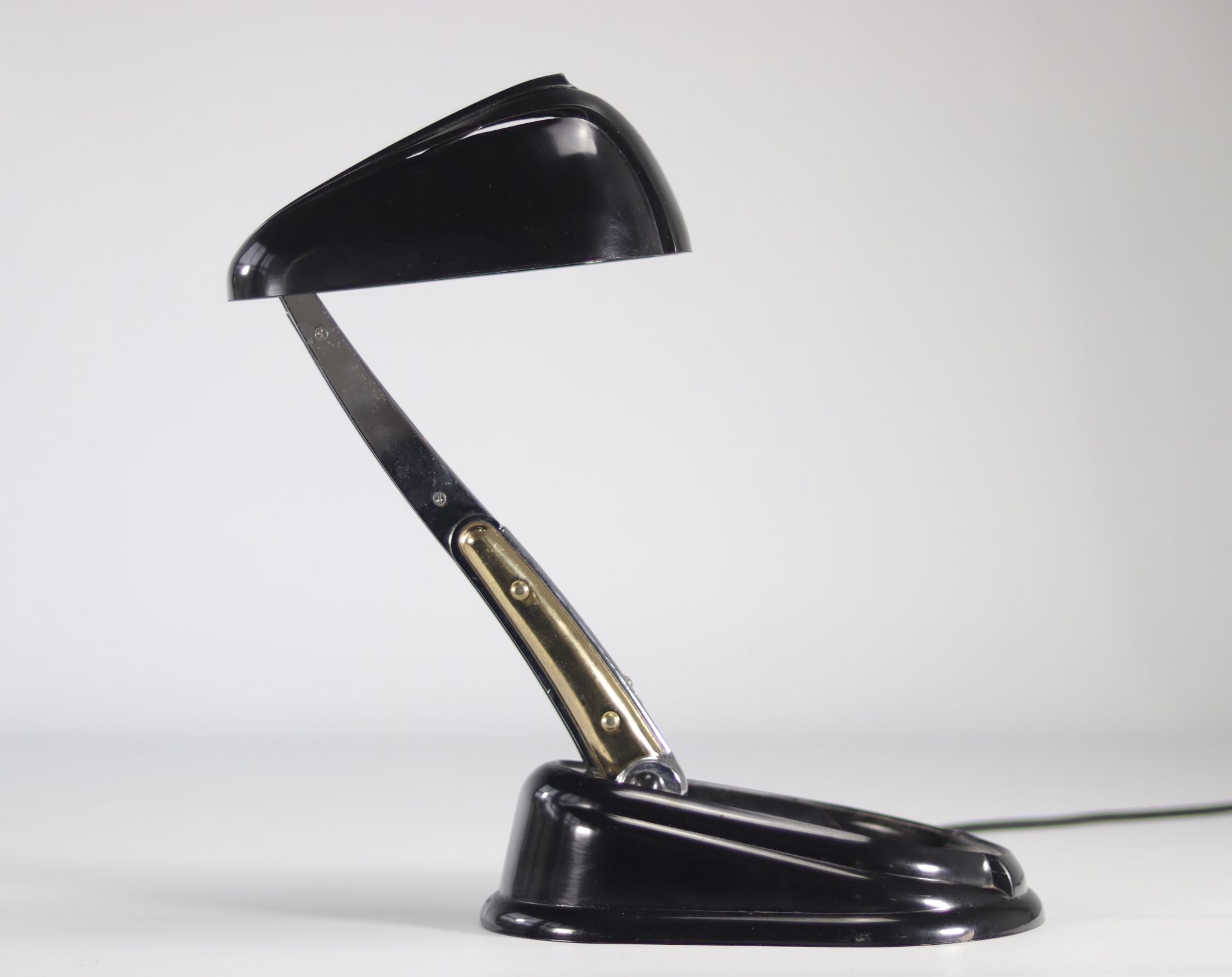 Jumo Articulated desk lamp with adjustable and retractable cap, bakelite model called "Bolide"