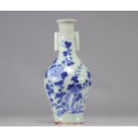 Chinese porcelain vase on celadon background