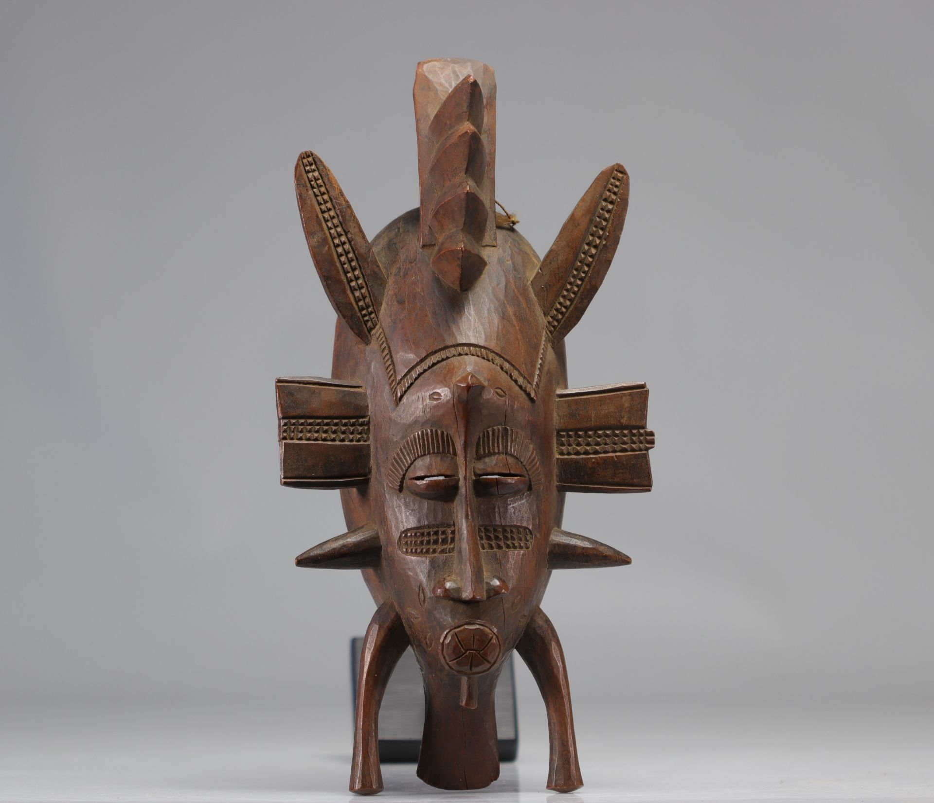 Senufo mask in wood remains of black patina XXth