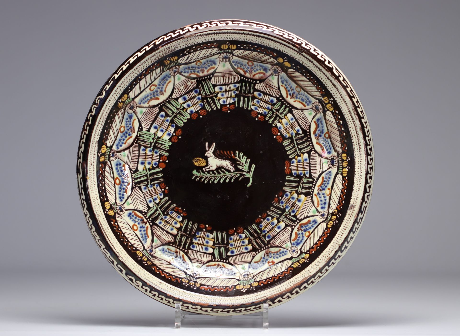 Glazed stoneware plate decorated with a rabbit
