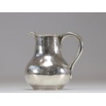 Sterling silver milk jug decorated with coat of arms