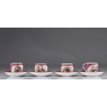 Meissen porcelain cups and saucers decorated with romantic scenes in red on a white background