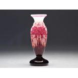 Le Verre Francais acid-etched vase decorated with pink rhododendrons on a white background