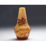 Devez acid-etched vase decorated with red flowers on an orange background