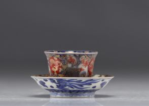 Japanese porcelain bowl and saucer in blue and red with mark under the piece