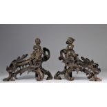 (2) Imposing pair of bronze andirons decorated with children in the Louis XV style