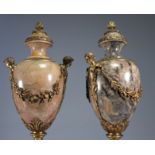 Imposing pair of marble and bronze cassolettes decorated with heads and flowers