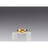 Gold ring with circular citrine center