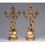 (2) Imposing pair of gilded bronze candelabra with marble base and "angels supporting the torches".