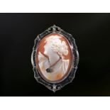 14k white gold brooch set with a cameo representing a woman in profile in bloom, with a genuine diam