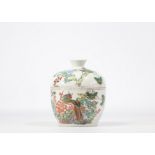 Chinese qianjiang cai porcelain covered pot decorated with animals and flowers on a white background