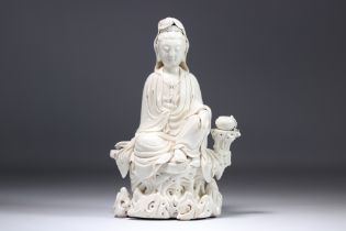 Chinese white porcelain Guanyin seated on a rock