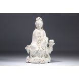 Chinese white porcelain Guanyin seated on a rock