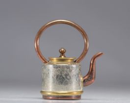 Chinese teapot decorated with immortals on a gray background