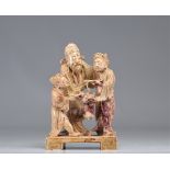 Sculpture of three figures in hard stone originating from China