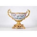 Large famille rose porcelain bowl decorated with a phoenix with an ormolu mount from 18th century