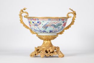 Large famille rose porcelain bowl decorated with a phoenix with an ormolu mount from 18th century