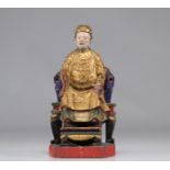 Chinese polychrome wooden sculpture of a dignitary in gilded garb decorated with a dragon from the 1