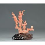 Pink coral sculpture of young women and children from China, Republic period