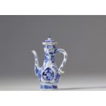 White and blue porcelain teapot with floral decoration from the 17th century Kangxi