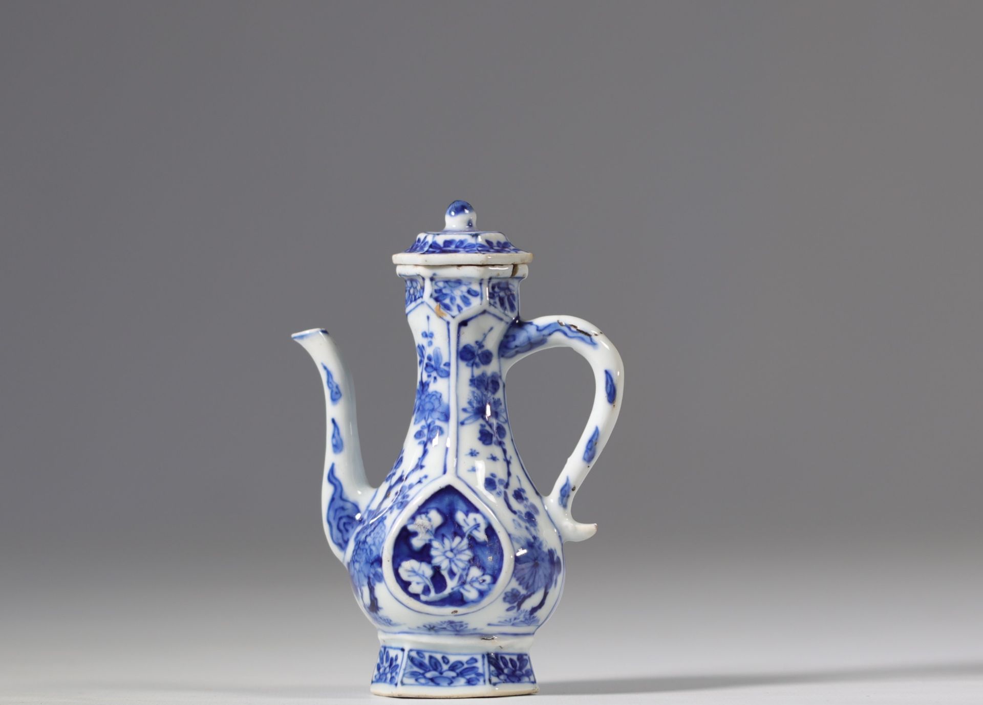 White and blue porcelain teapot with floral decoration from the 17th century Kangxi