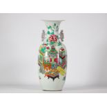 Famille rose porcelain vase decorated with different coloured furniture from the 19th century